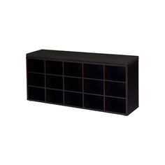 a large black shelf with many compartments on the top and bottom, in front of a white background