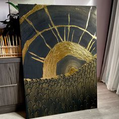 an abstract painting with gold and black colors