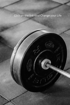 a black and white photo of a barbell with the words, click on the link and change your life