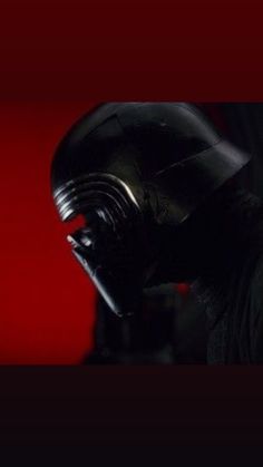 a darth vader helmet is shown in the dark side up image with red background