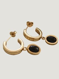 Turn heads with the exquisite 18K Gold Dainty Black Onyx Drop Earring from Furano Studio. These stunning statement earrings feature a black onyx drop set in 18K gold, creating a bold and elegant look. Crafted with 925 sterling silver, these earrings are hypoallergenic and water-resistant, making them ideal for sensitive skin. The dainty design adds a touch of sophistication to any outfit, and the water-resistant quality ensures lasting beauty. Additional Details: Product Type: Statement Earrings Furano, Gemstone Drop Earrings, Gold Plated Sterling Silver, Gold Material, Black Onyx, Statement Earrings, Onyx, 18k Gold, Gold Plate