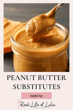 peanut butter in a glass jar with a spoon