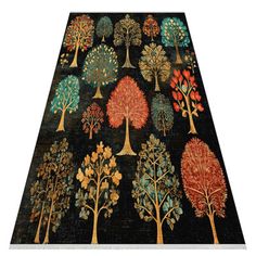 an area rug with trees on it in various colors and sizes, including oranges, blue