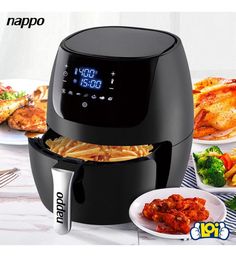 an air fryer with pasta and meat in it next to other food on plates