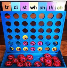 a blue board game with numbers and letters on it