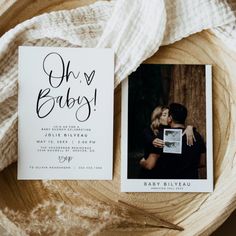 an image of a baby announcement card on top of a wooden bowl