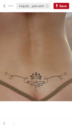 a woman with a tattoo on her stomach