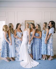 a group of women standing next to each other