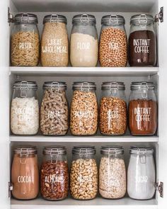 an organized pantry filled with lots of different types of food and drinks in glass jars