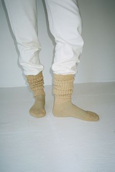 Slouchy knee high socks in a cotton/nylon blend. Thick ribbed cuff and a slim, fitted foot. Made in the USA. Available in multiple colors. Layered Socks, Cream Socks, Slouch Socks, Beige Jeans, Thick Socks, Black Socks, Knee High Socks, Fall 2023, Cool Socks