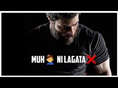 a man wearing a black t - shirt with the words muh n'lagata x on it