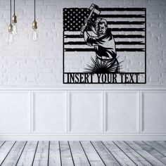 a white room with a brick wall and an american flag painted on the wall above it