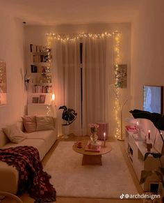 a living room filled with furniture and a flat screen tv on top of a wooden table