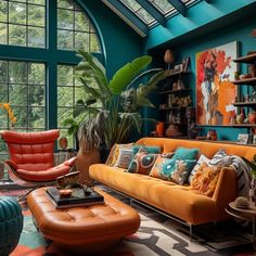 a living room filled with lots of furniture and large windows covered in blue skylights