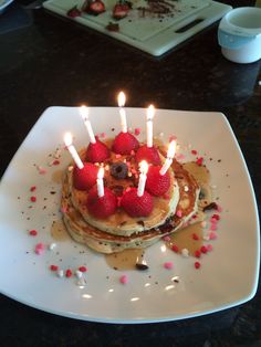 pancakes with strawberries and chocolate chips on a plate