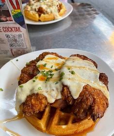 fried chicken and waffles with gravy on top