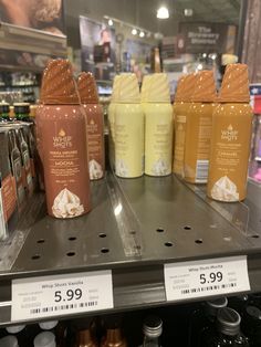 bottles of liquid are on display in a store