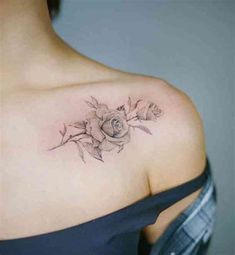 a woman with a rose tattoo on her shoulder