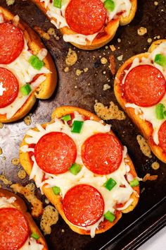 mini pizzas with pepperoni, cheese and green onions