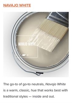 a paint can with a brush in it and the words navajo white above it