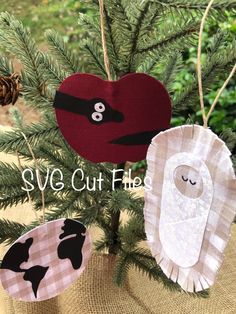 three paper ornaments hanging from a tree with the words svg cut files on them