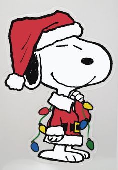 a snoopy christmas sticker with a red santa hat and lights on it's chest