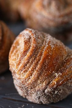 powdered sugar covered pastry sitting on top of a table