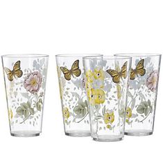 four glasses with butterflies and flowers painted on them