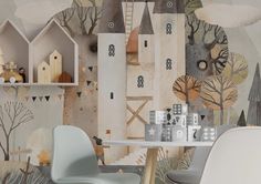 an artistic wallpaper with trees, houses and other things on it is shown in this room