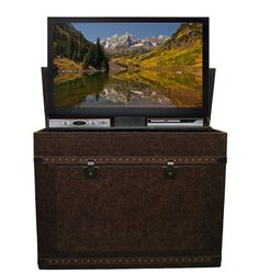 a television sitting on top of a trunk