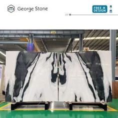 a large marble slab is being displayed in a storefront with the words george stone on it