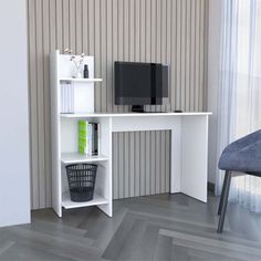 a white desk with a computer monitor and keyboard