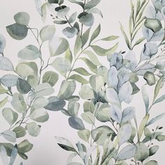 watercolor painting of green leaves and branches on a white wallpapered room background