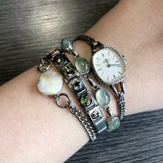 Silver jewelery bracelet stack Silver Watch Bracelet Stack, Jewellery Stack Ideas, Silver Stacked Jewelry Aesthetic, Lots Of Silver Jewelry Aesthetic, Silver Jewellery Stacking, Vintage Bracelet Stack, Silver Chain Stack, Bracelet Stacks Ideas, Cool Girl Jewelry Silver