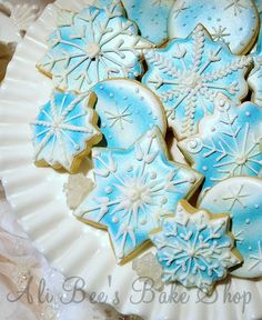 blue and white decorated cookies on a plate