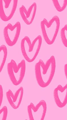 a pink background with lots of hearts drawn on it