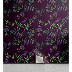 a purple wallpaper with green leaves on it