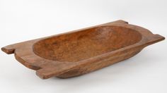 a wooden bowl on a white background