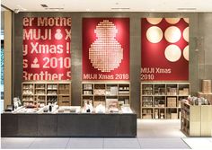 the interior of a book store with red and white wallpapers on the walls