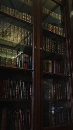 an old bookcase with many books in it