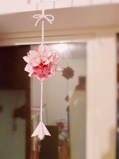 a pink flower hanging from the ceiling