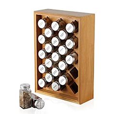 a wooden spice rack filled with lots of spices