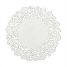 white doily on a white background with an oval shape in the center and small circles at the bottom