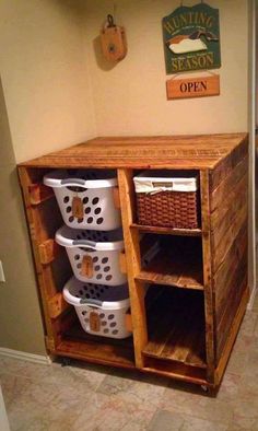 an old wooden cabinet with baskets on it