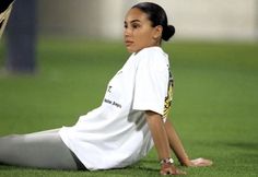 a female soccer player laying on the ground