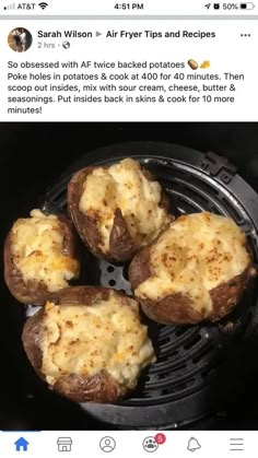 four baked potatoes in an air fryer with cheese on top and the words,