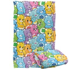 a colorful blanket with many different colored teddy bears on it's back and sides