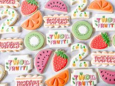 some decorated cookies are laying on a table with the words happy birthday written in it