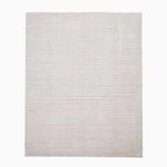 a white rug with vertical stripes on the bottom, and horizontal lines in the middle