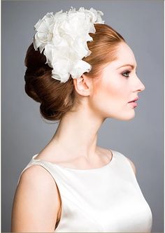 a woman with a flower in her hair